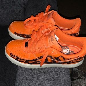 The Nike Air Force 1 Orange Skeleton comes on both sides